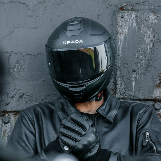 orion 2 matt black motorcycle helmet for men worn by biker in all black biker gear