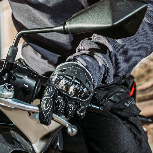 biker wearing black and white ventilated summer spada motorbike gloves