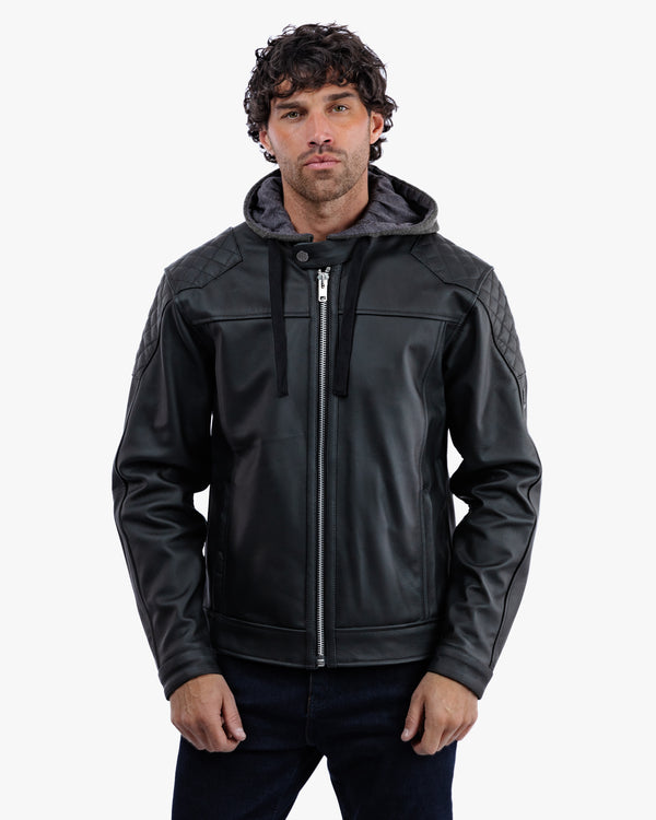 Man wearing a black leather jacket with a gray hood on a white background