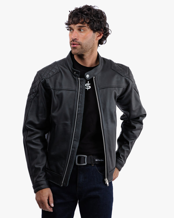 Man wearing a black leather jacket with a brand logo on a white background