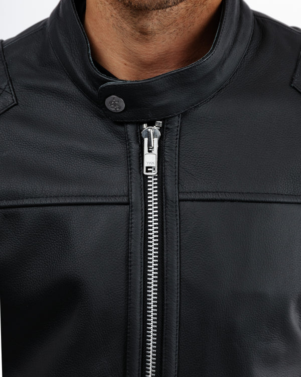 Close-up of a black leather jacket with a zipper