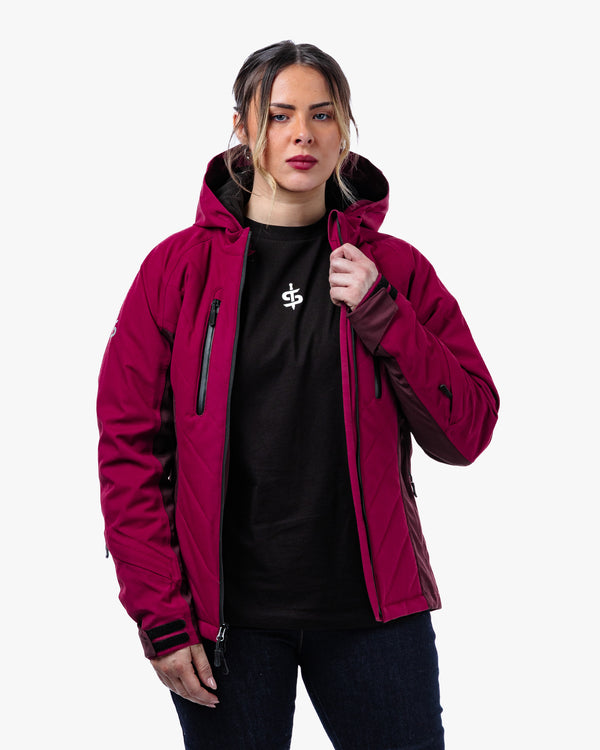 woman wearing a red and black women's motorbike jacket with hood and adjustable cuffs