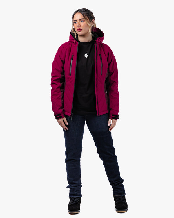 woman wearing a quilted red ladies motorcycle jacket with motorbike jeans