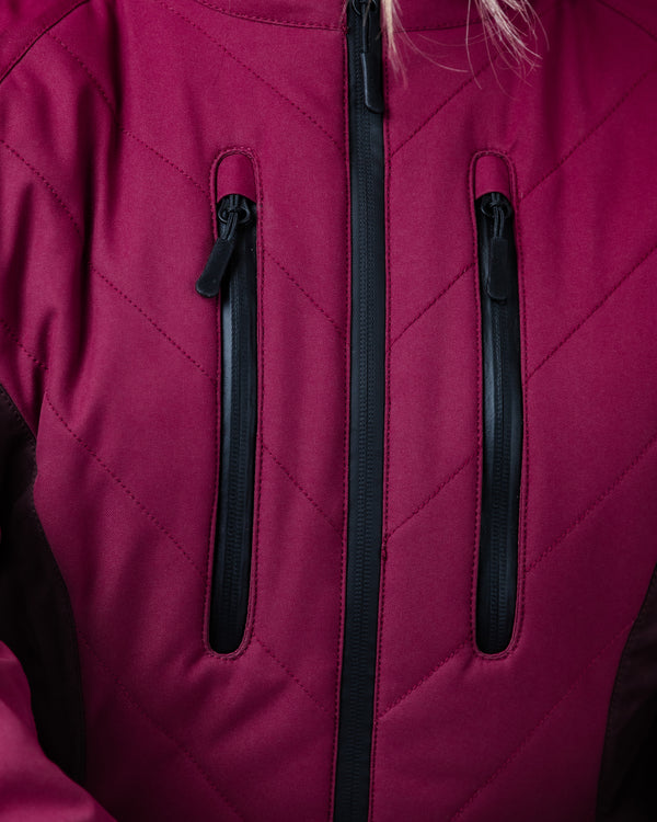 Close-up of a maroon jacket with black zippers