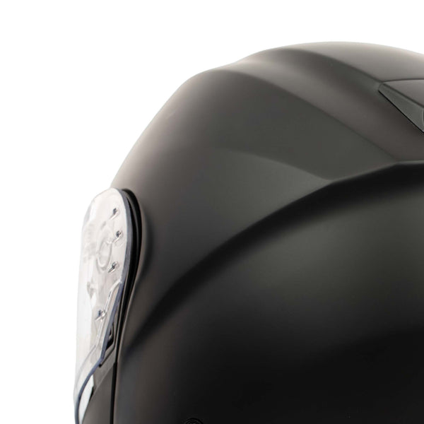 Close-up of a black motorcycle helmet with a white logo on a white background