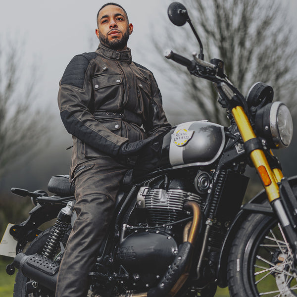Rider on motorbike wearing matching Crossguard jacket and trousers for men, ready for all-weather riding