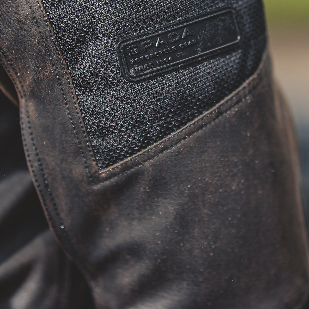 Close-up of jacket sleeve detailing, highlighting vented panels and heavy-duty stitching