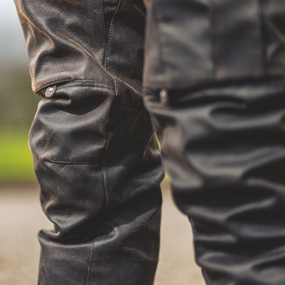closeup of brown trousers with armour in knee for motorcycling