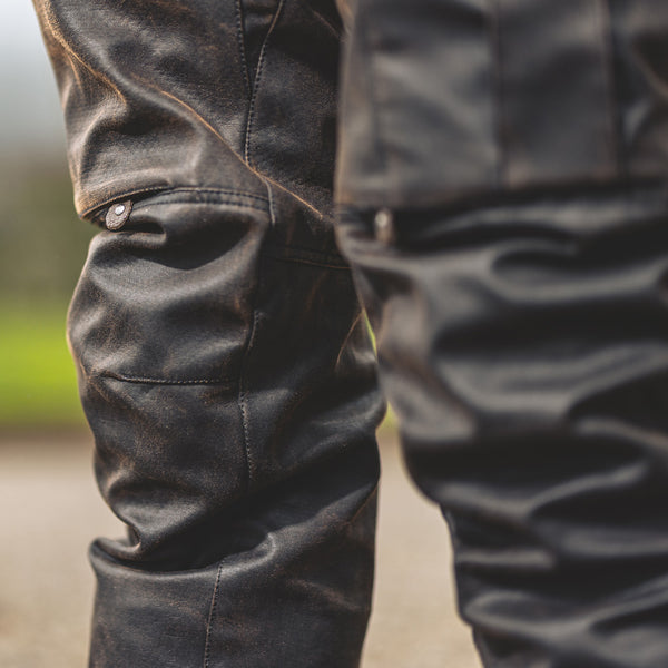 closeup of brown trousers with armour in knee for motorcycling