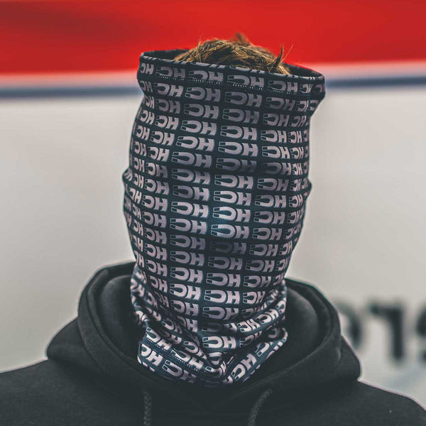 dean harrison wearing the DC logo merch neck tube pulled to the top