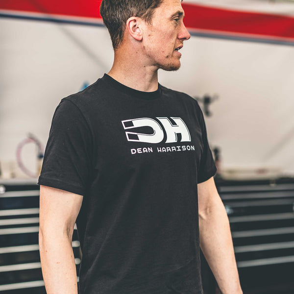 closeup of dean harrison logo on front of t-shirt