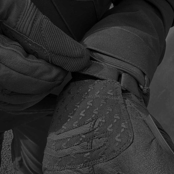 biker putting on junction spada gloves with adjustable cuff