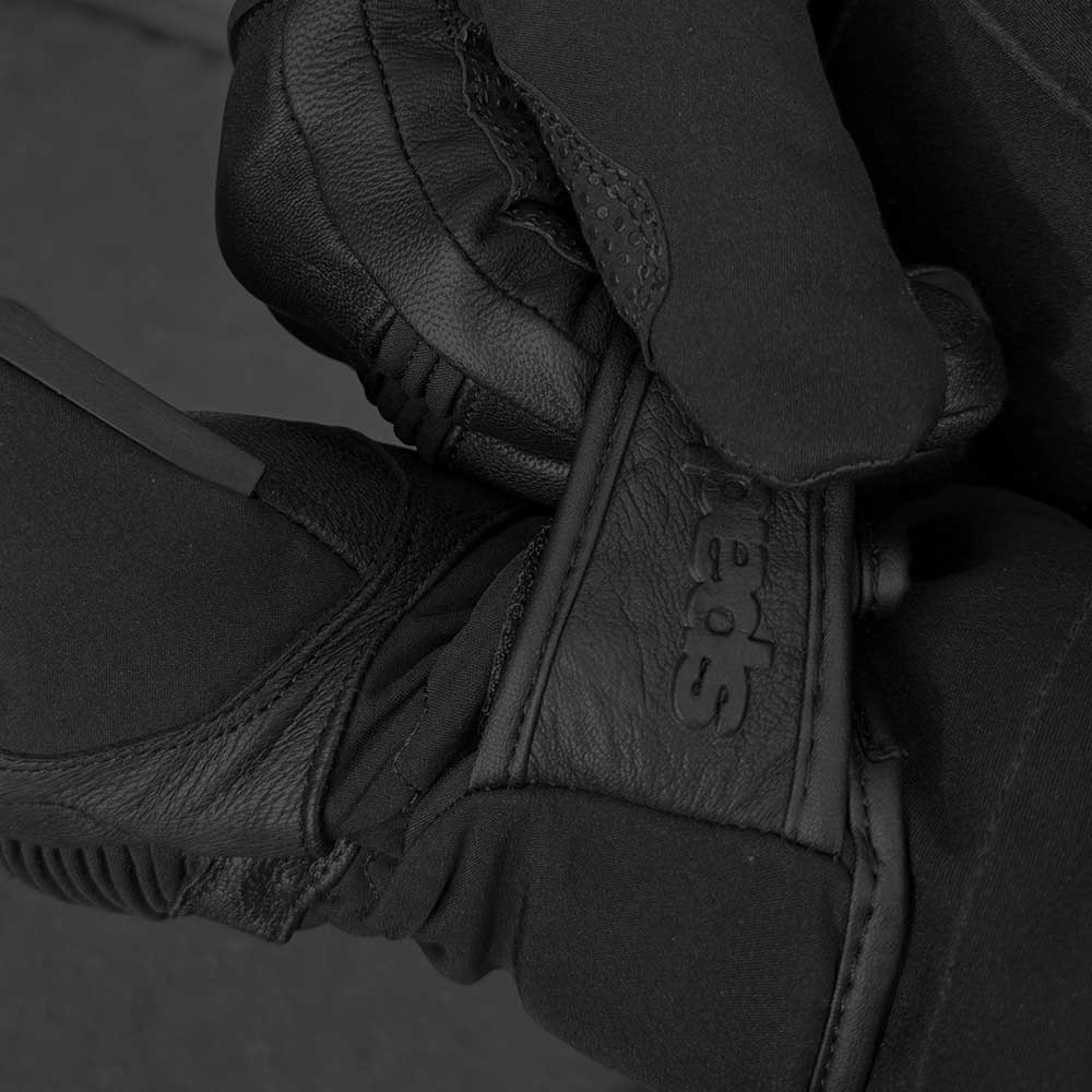 closeup of biker fastening black leather oslo gloves with velcro strap