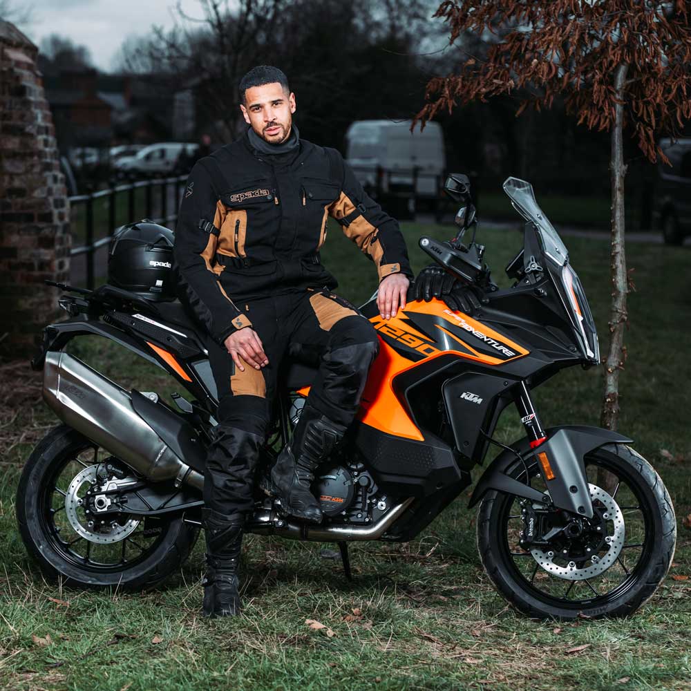 biker on motorbike wearing full motorcycle adventure gear
