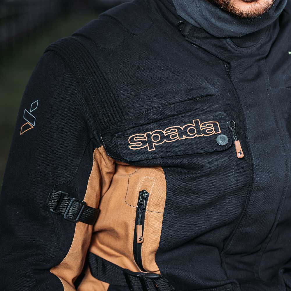 closeup of black and brown motorcycle jacket pockets