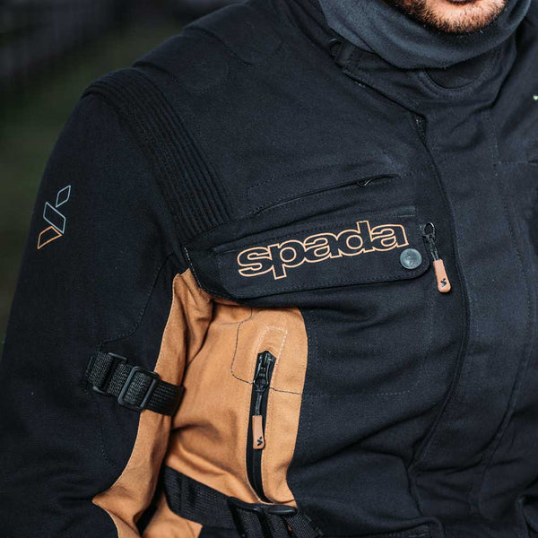 closeup of black and brown motorcycle jacket pockets