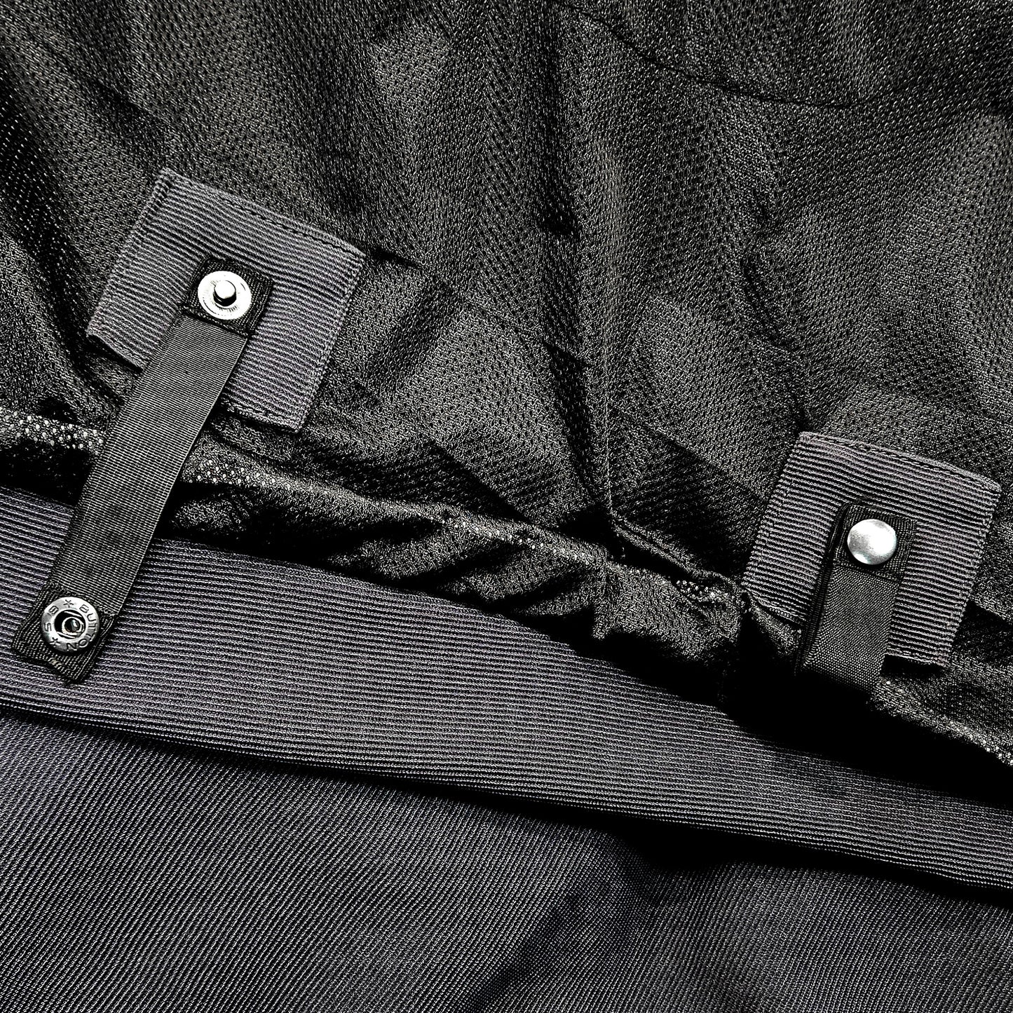 Close-up of belt loop attachment on Blade Grey zip-up motorcycle hoodie – secure fit to trousers for safe riding