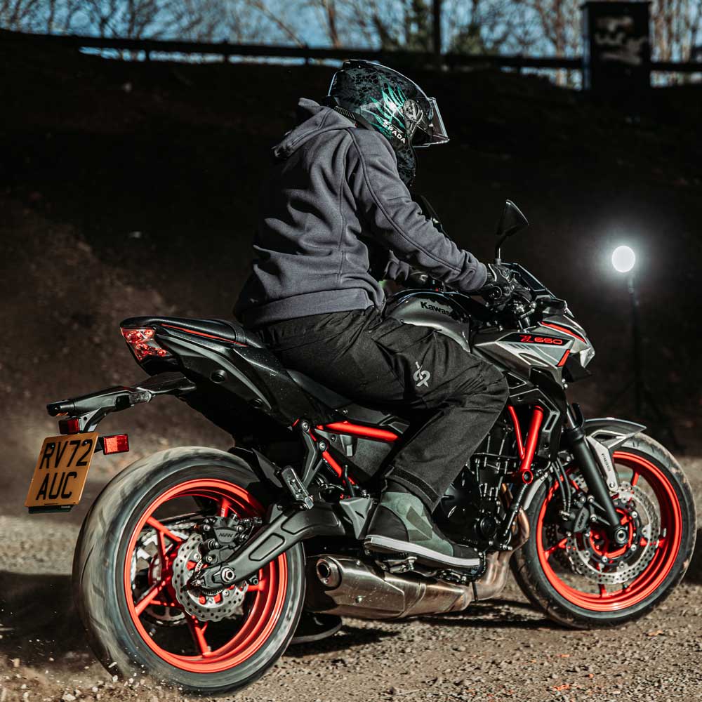 Rear view of biker in Blade Grey motorbike hoodie seated on bike – showing hoodie’s back profile and protective fit