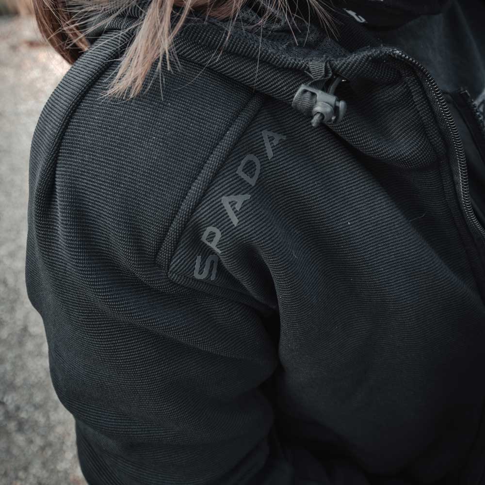 Detail view of shoulder and logo on Blade Black motorcycle hoodie – showcasing reinforced build and signature design