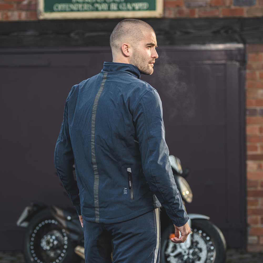 back of biker wearing blue motorbike jacket with black strip