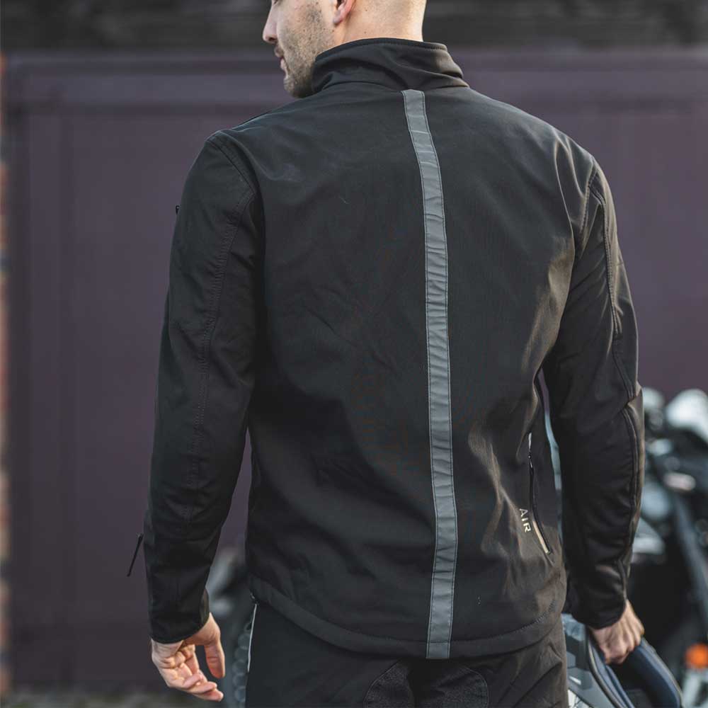 back of biker wearing black motorcycle jacket with back strip