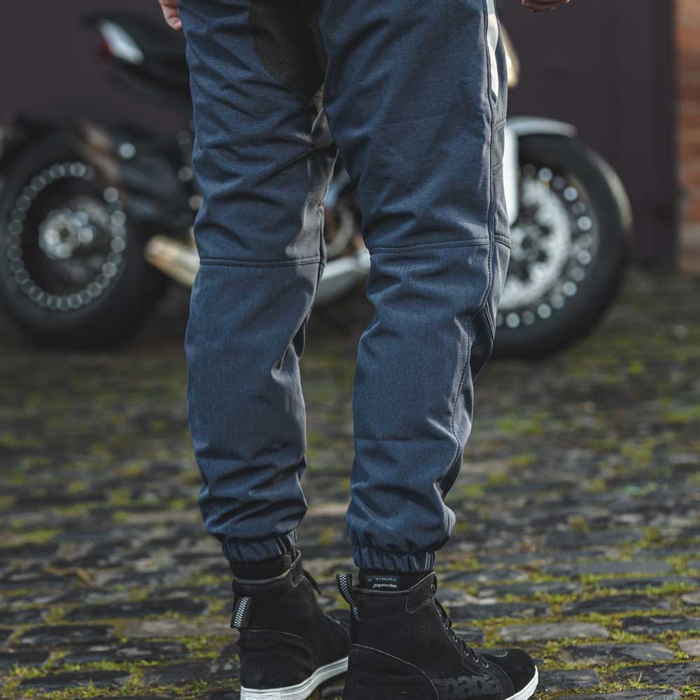 closeup of back of blue motorcycle trousers for men
