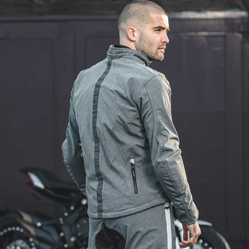 back of biker wearing grey motorbike jacket with back pockets