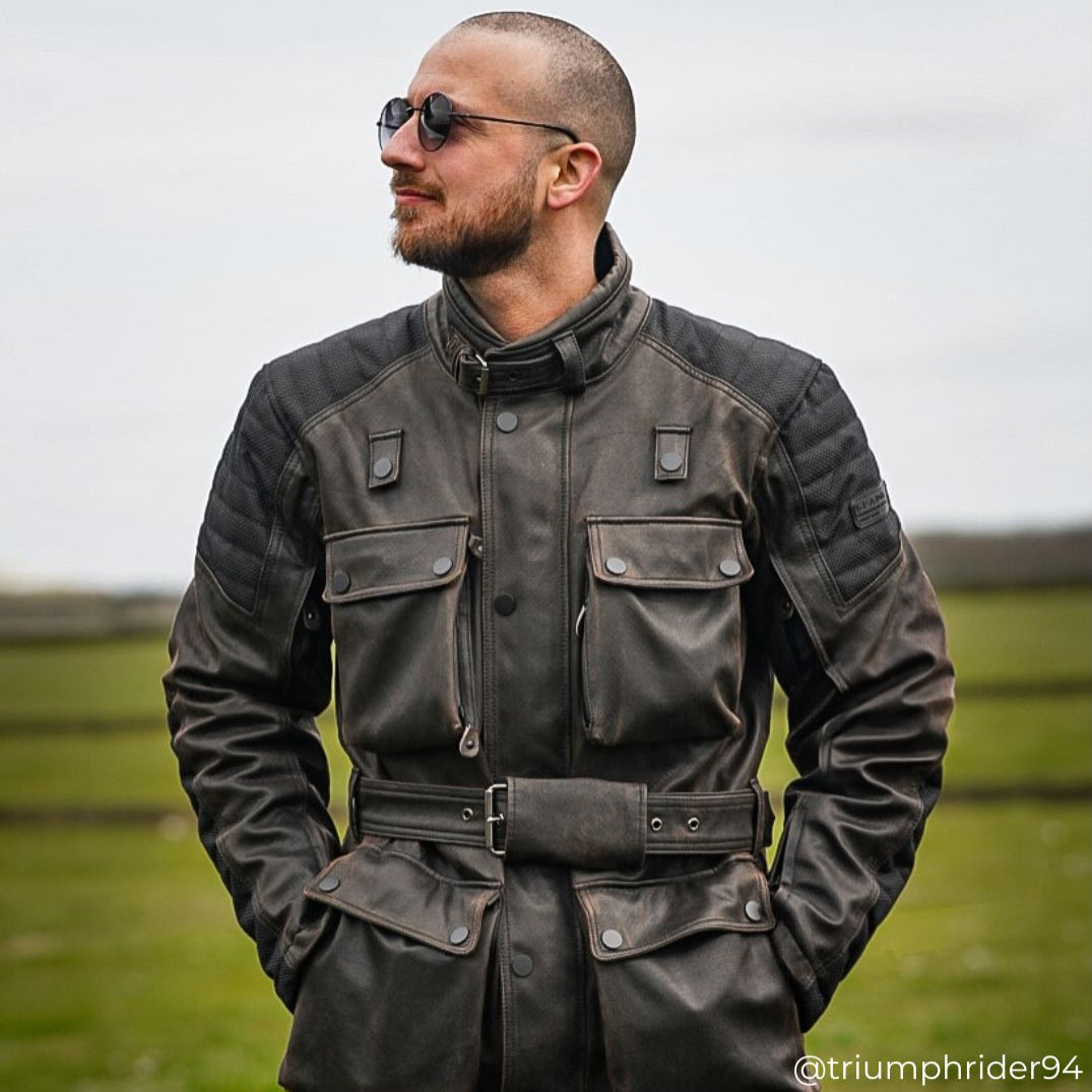 Biker wearing Crossguard Walnut Brown jacket, close-up showing waterproof fabric and protective armour details