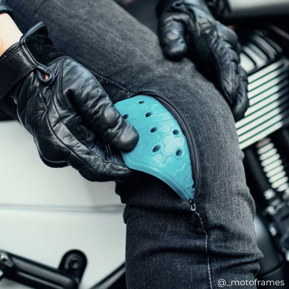 biker removing level 2 ce certified armour in motorcycle jeans
