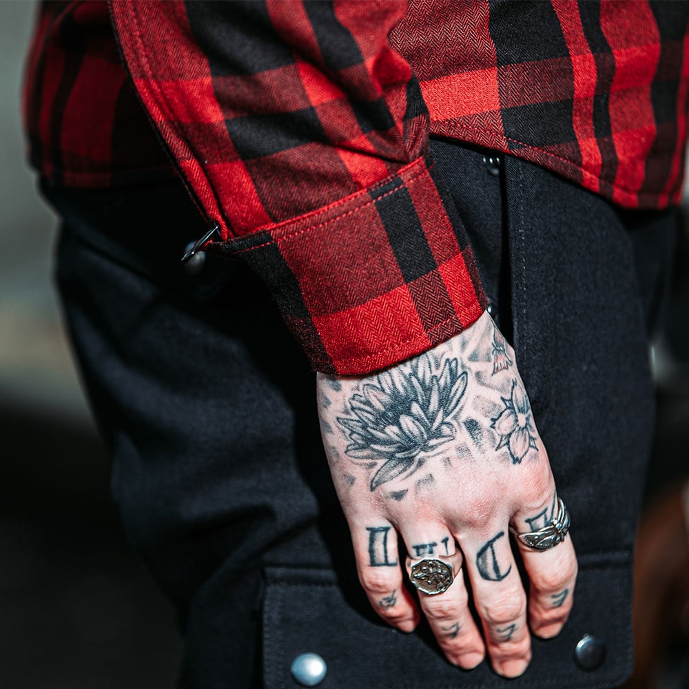 closeup of cuffs on black and red motorbike shirt for men