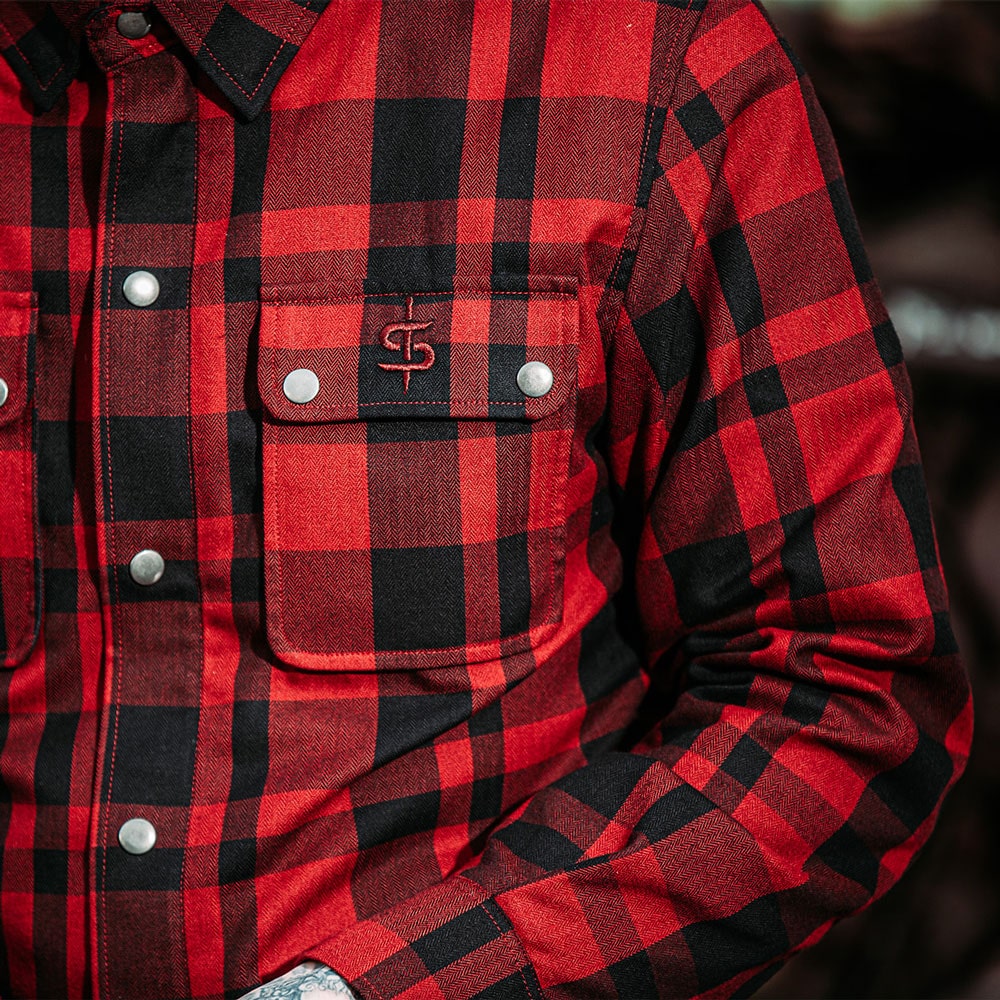 close up of chest pocket of red and black plaid design motorcycle shirt