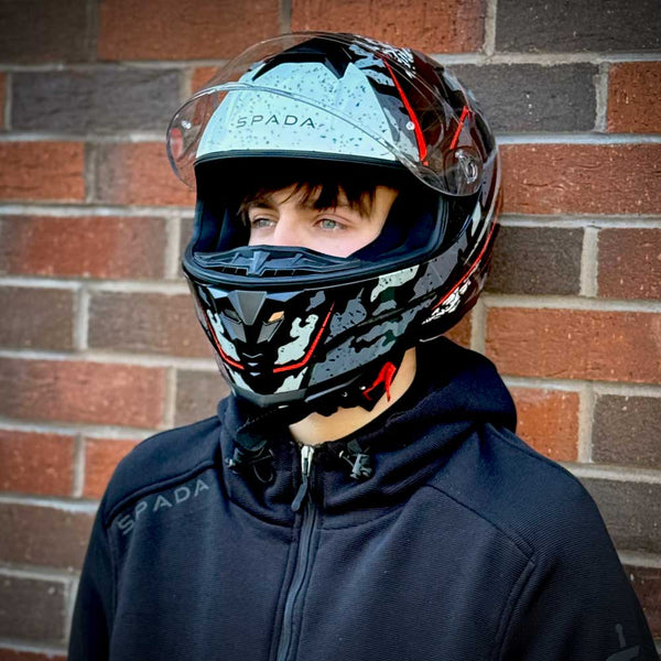 young biker wearing raiden 2 spada full face motorbike helmet with clear visor and motorbike hoodie