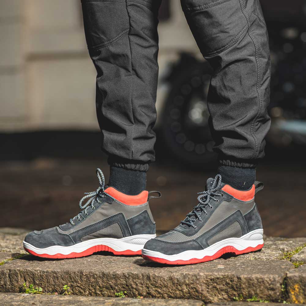 black and red motorcycle trainers after a motorbike ride