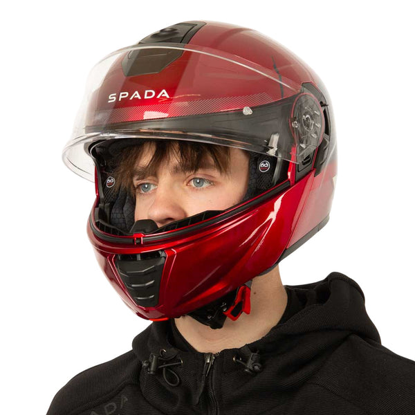 side view of red motorbike helmet worn by biker