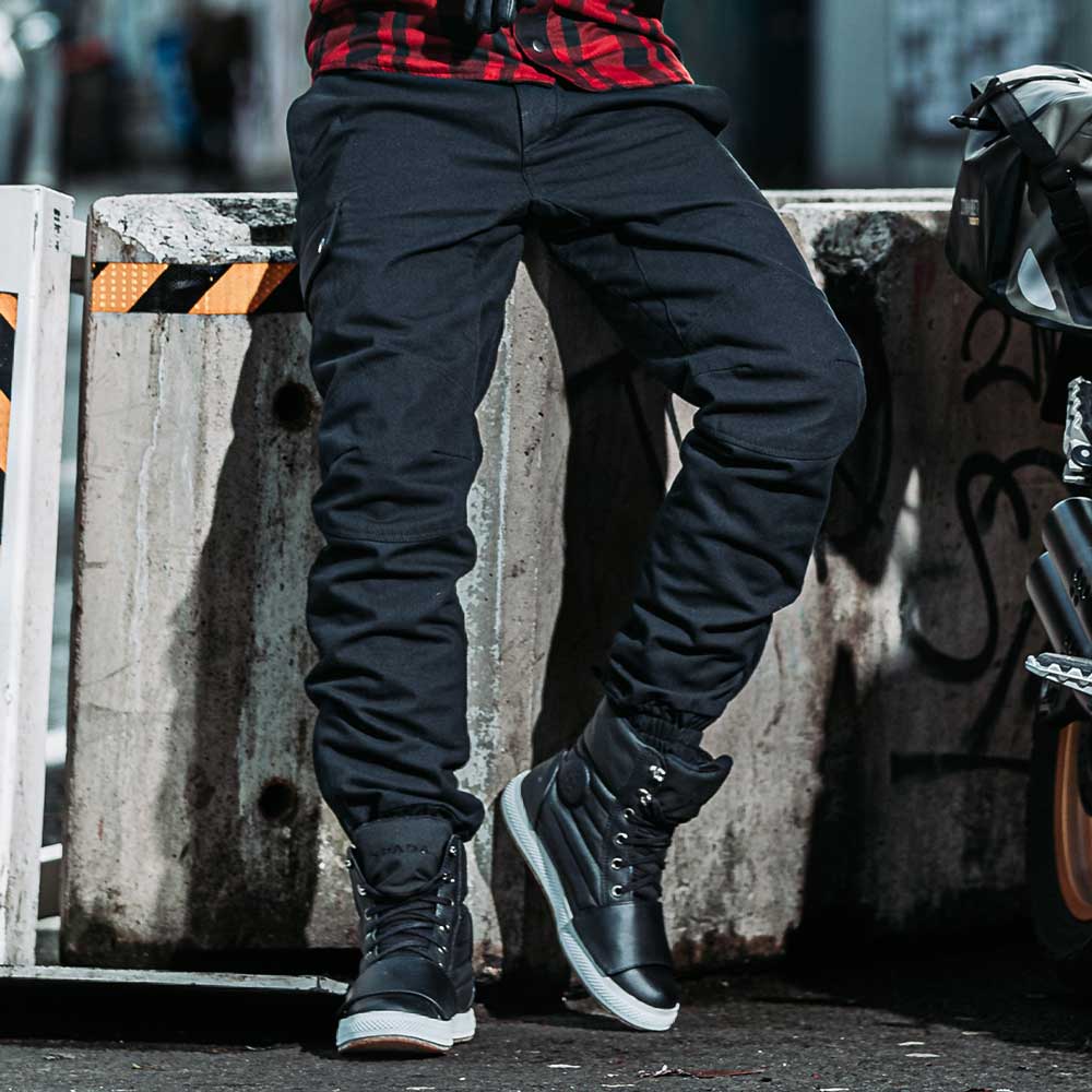 mens black motorcycle trousers with black motorcycle trainers with ger changing pad