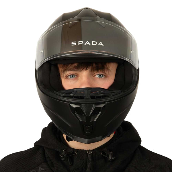 front of matte black motorbike helmet with clear visor lifted up