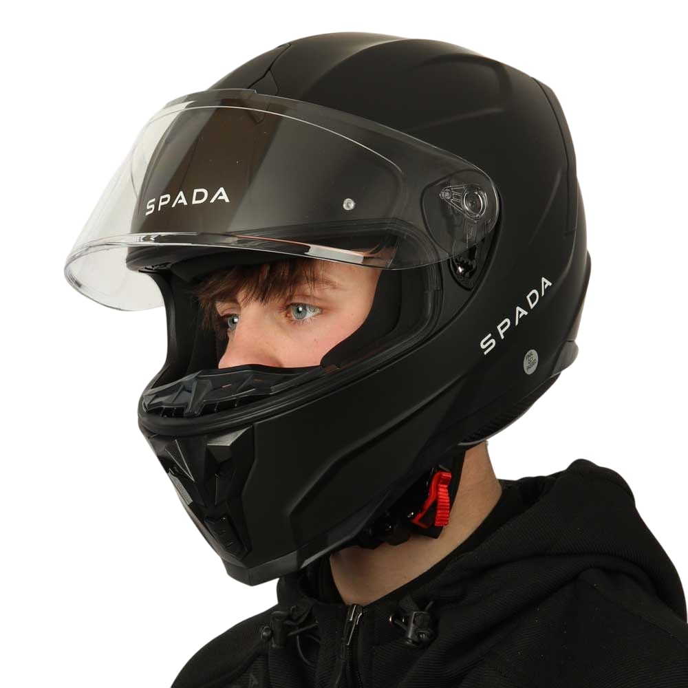 side of black motorbike helmet with white spada logo and clear visor