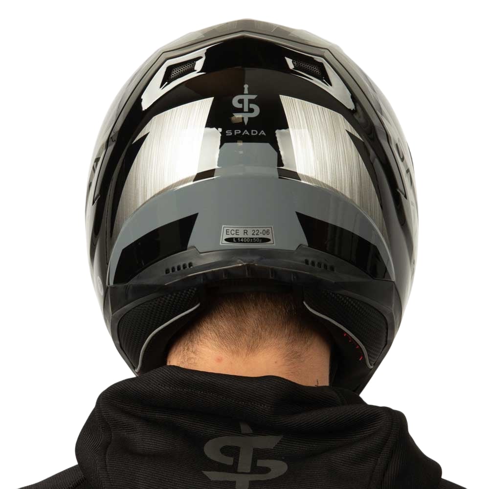 back of grey silver and black motorbike helmet