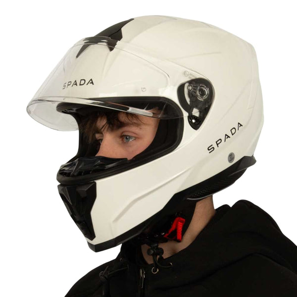 side view of biker wearing white full face motorbike helmet with black vents