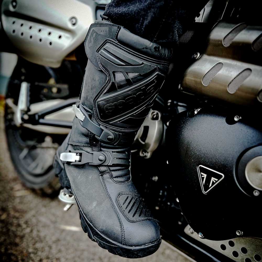 biker on motorbike wearing black motorcycle boots for men