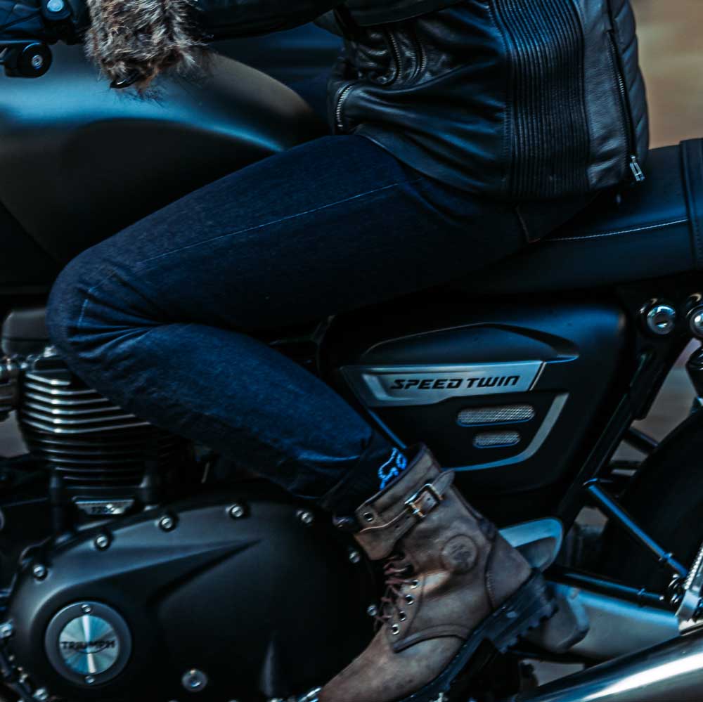 woman riding motorbike wearing motorcycle jeans with female fit