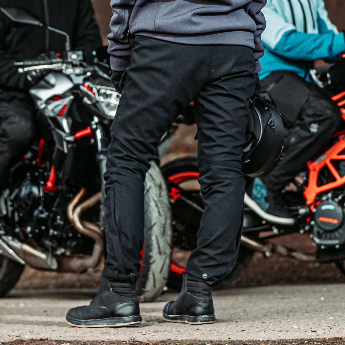 back of female biker wearing ladies black motorcycle trousers