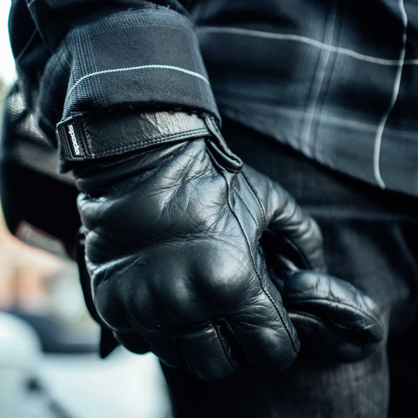 biker wearing black leather motorcycle gloves for men