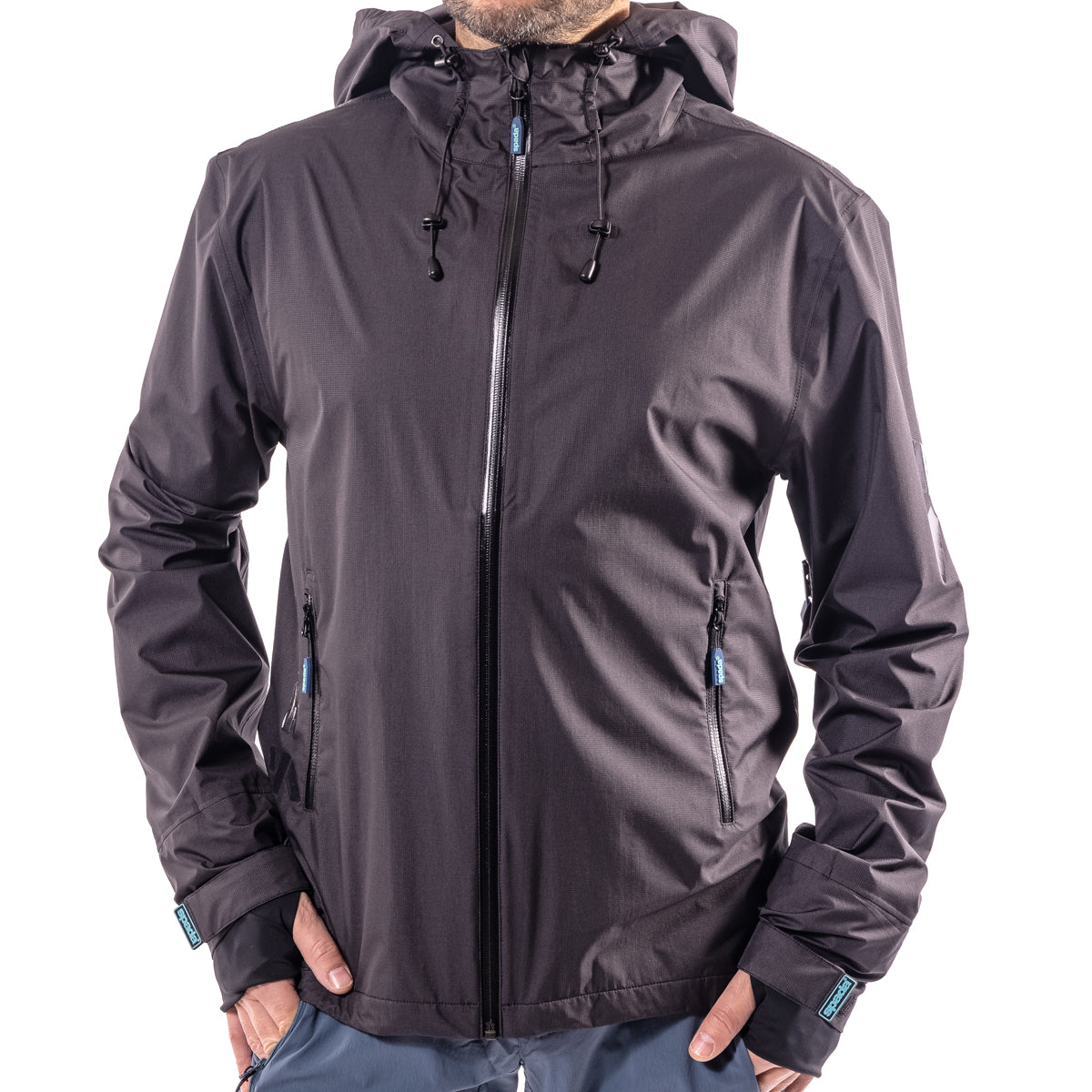 A black mountain biking jacket with a full zipper, hood, and visible branded tags on the cuffs.