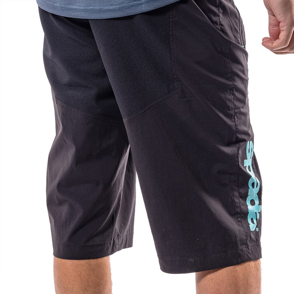 back of someone wearing black mountain biking shorts for men