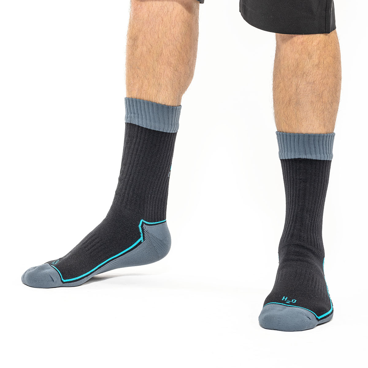 man wearing grey and black socks with blue details with shorts