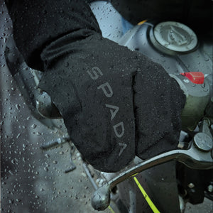 biker wearing black claw finger waterproof motorcycle gloves
