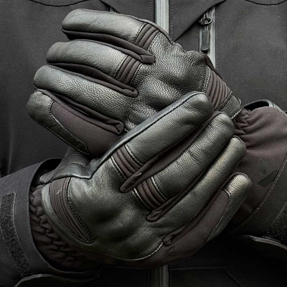 biker wearing black leather motorcycle gloves