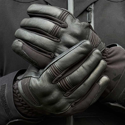 biker wearing black leather motorcycle gloves