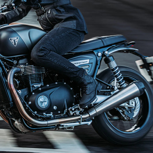 woman motorcycle rider with black ladies motorcycle boots